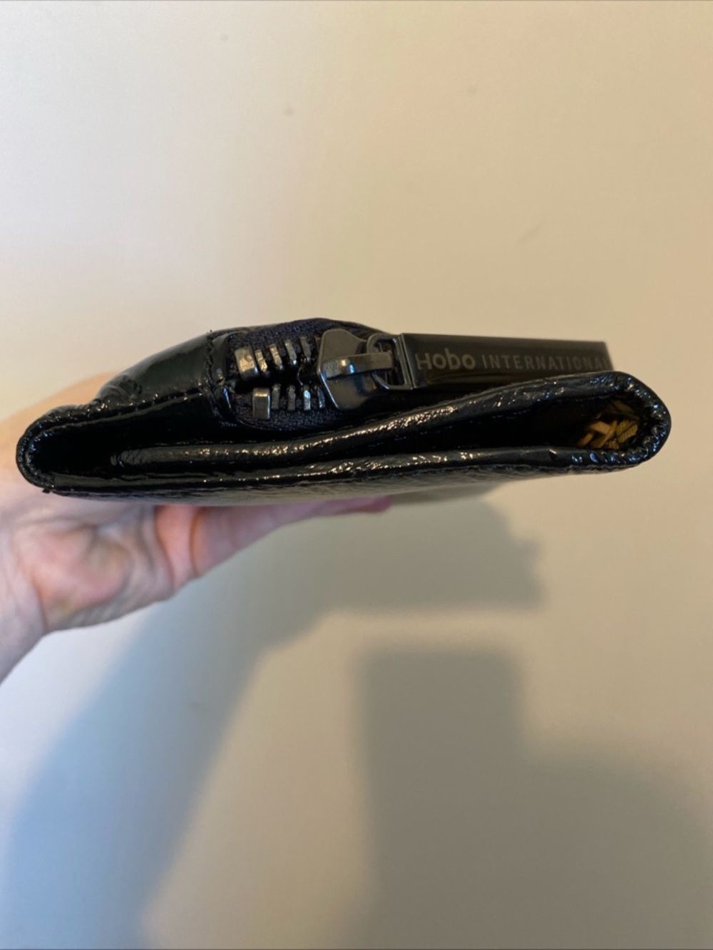 HOBO Black Patent Fold-Over Clutch with Diagonal Zip Magnetic Closure - Picture 6 of 15